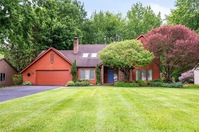 41 Pond Valley Cir, Penfield, NY 14526 - view of front of home with a chimney, an attached garage, a front yard, asphalt driveway, and a shingled roof