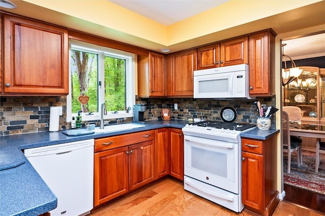 41 Pond Valley Cir, Penfield, NY 14526 - kitchen with white appliances, a sink, light wood-style flooring, and brown cabinets
