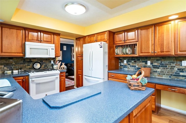 41 Pond Valley Cir, Penfield, NY 14526 - kitchen featuring white appliances, decorative backsplash, brown cabinets, and dark countertops