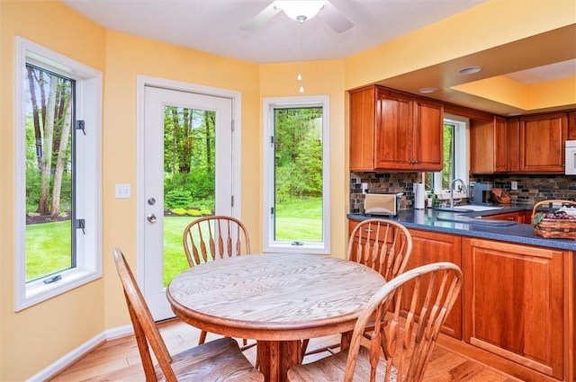 41 Pond Valley Cir, Penfield, NY 14526 - kitchen with a sink, dark countertops, healthy amount of natural light, and brown cabinets