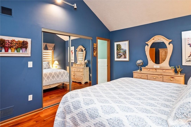 41 Pond Valley Cir, Penfield, NY 14526 - bedroom featuring wood finished floors, vaulted ceiling, and a closet
