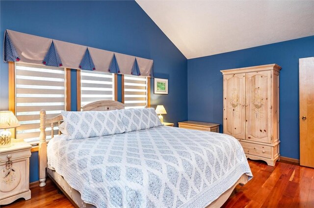 41 Pond Valley Cir, Penfield, NY 14526 - bedroom with wood finished floors, lofted ceiling, and baseboards