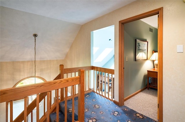 41 Pond Valley Cir, Penfield, NY 14526 - hall featuring carpet, vaulted ceiling, an upstairs landing, and baseboards