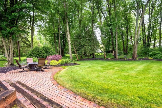 41 Pond Valley Cir, Penfield, NY 14526 - view of grassy yard featuring a patio