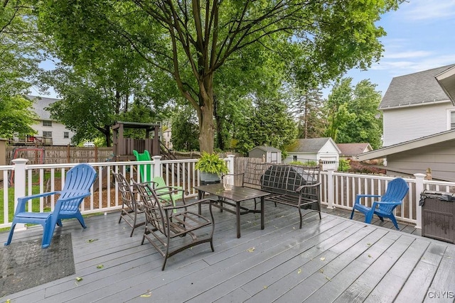 622 Stinard Ave, Syracuse, NY 13207 - wooden terrace with a playground and a fenced backyard