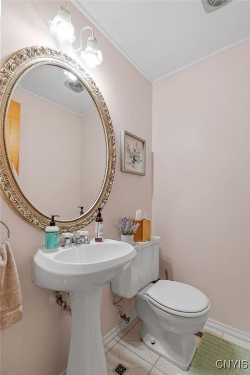 622 Stinard Ave, Syracuse, NY 13207 - bathroom featuring tile patterned flooring, toilet, baseboards, and ornamental molding