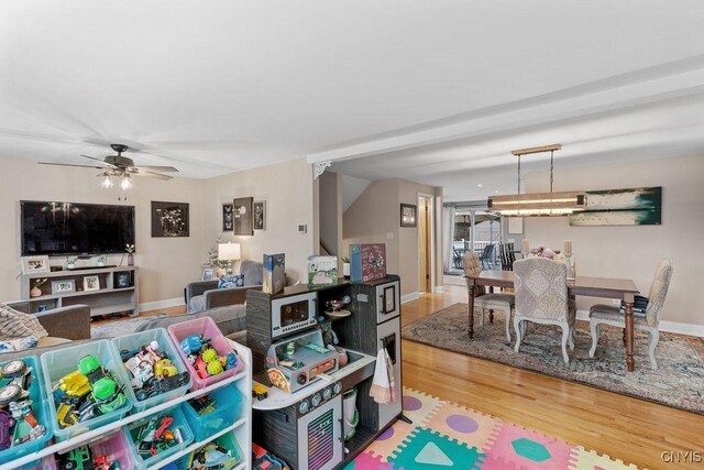 622 Stinard Ave, Syracuse, NY 13207 - living room featuring wood finished floors, a ceiling fan, and baseboards