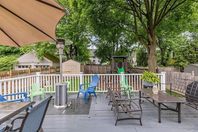 622 Stinard Ave, Syracuse, NY 13207 - wooden terrace featuring a fenced backyard and a playground