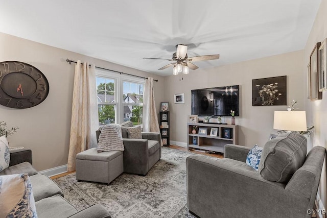 622 Stinard Ave, Syracuse, NY 13207 - living room featuring baseboards and ceiling fan