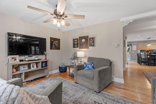 622 Stinard Ave, Syracuse, NY 13207 - living area with a ceiling fan, wood finished floors, and baseboards