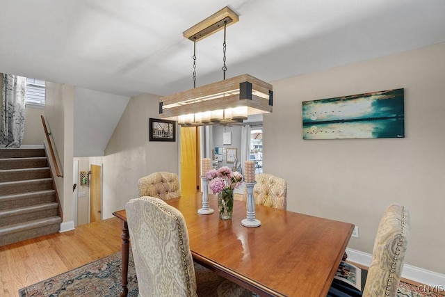 622 Stinard Ave, Syracuse, NY 13207 - dining space with stairs, wood finished floors, and healthy amount of natural light