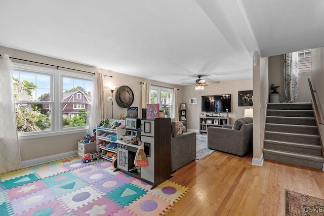 622 Stinard Ave, Syracuse, NY 13207 - living room with baseboards, stairway, wood finished floors, and ceiling fan