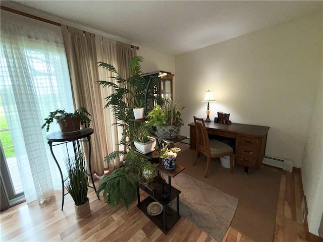 1476 Grange Hall Rd, Junius, NY 14532 - office area featuring a baseboard heating unit and wood finished floors