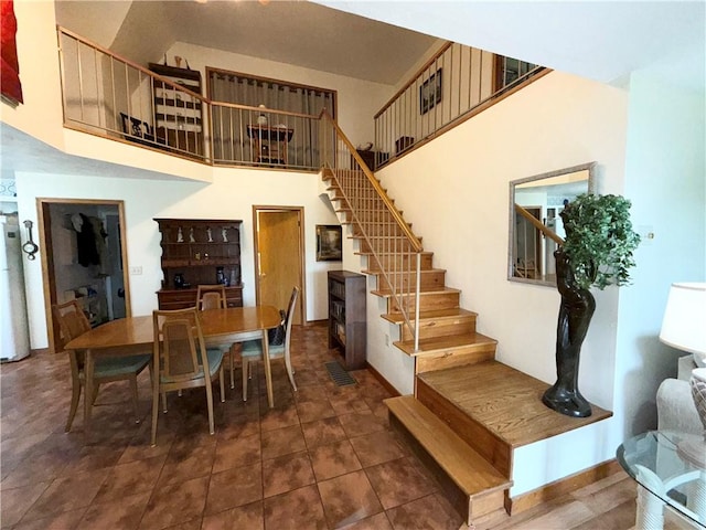 1476 Grange Hall Rd, Junius, NY 14532 - dining room featuring a towering ceiling and stairs