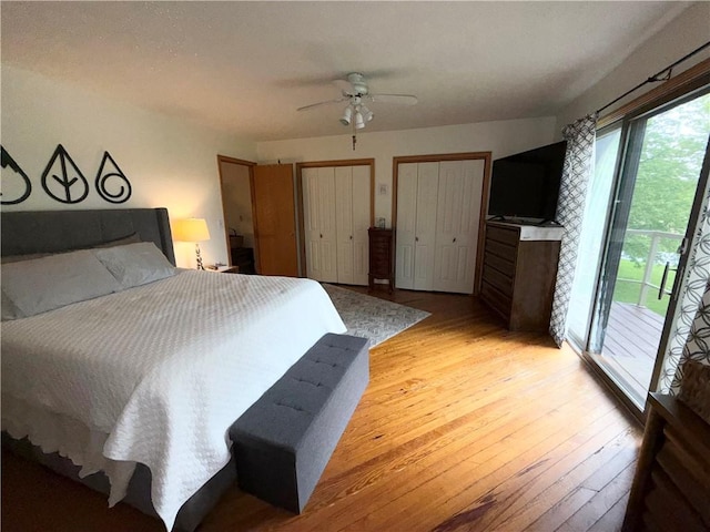 1476 Grange Hall Rd, Junius, NY 14532 - bedroom featuring access to exterior, light wood-style floors, two closets, and a ceiling fan