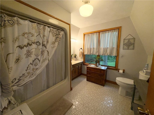 1476 Grange Hall Rd, Junius, NY 14532 - bathroom featuring toilet, vanity, shower / bathtub combination with curtain, tile patterned floors, and baseboards