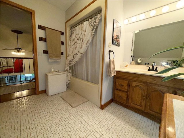 1476 Grange Hall Rd, Junius, NY 14532 - bathroom featuring baseboards, ceiling fan, vanity, and shower / tub combo