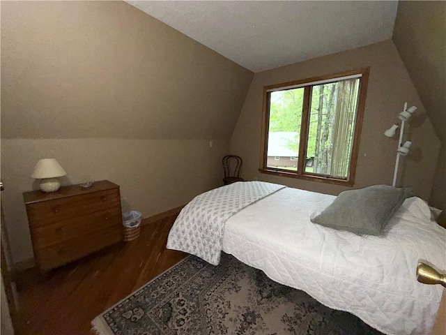 1476 Grange Hall Rd, Junius, NY 14532 - bedroom featuring lofted ceiling, wood finished floors, and baseboards