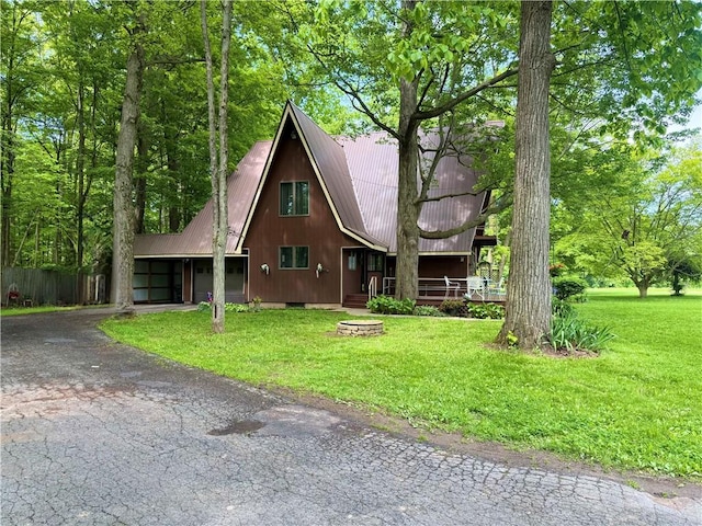 1476 Grange Hall Rd, Junius, NY 14532 - a-frame style home with asphalt driveway, metal roof, and a front yard
