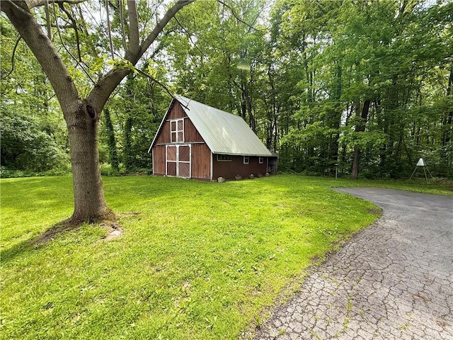 1476 Grange Hall Rd, Junius, NY 14532 - view of barn with a lawn and a forest view