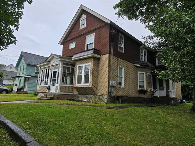 32 Vermont St, Bath, NY 14810 - view of front of property featuring a sunroom and a front yard