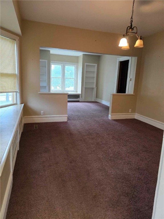 32 Vermont St, Bath, NY 14810 - unfurnished room featuring dark colored carpet, baseboards, and radiator