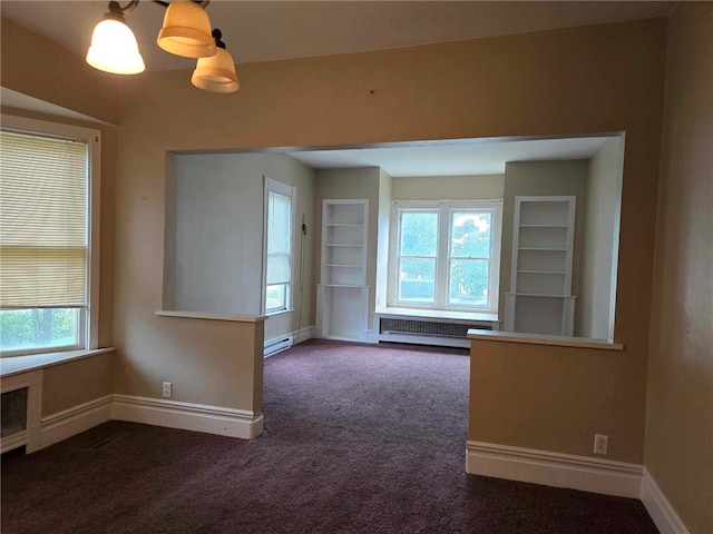 32 Vermont St, Bath, NY 14810 - empty room featuring carpet floors, healthy amount of natural light, and baseboards