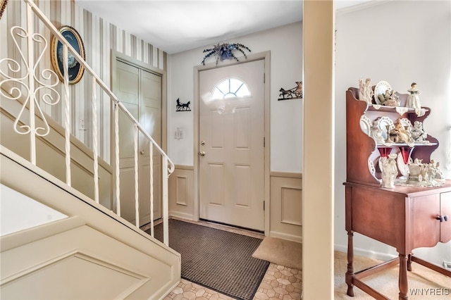 131 Idlewood Dr, Aurora, NY 14127 - foyer entrance featuring stairs and wainscoting