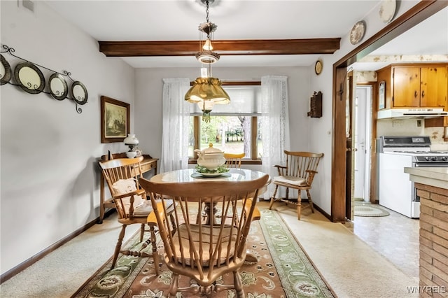 131 Idlewood Dr, Aurora, NY 14127 - dining space featuring baseboards, beamed ceiling, and light carpet