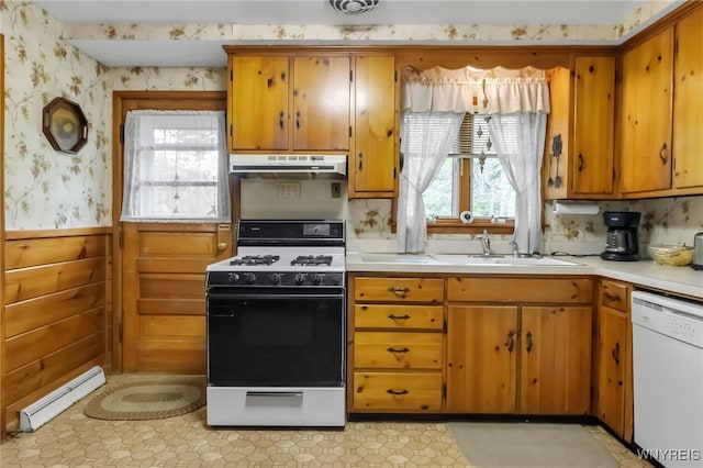 131 Idlewood Dr, Aurora, NY 14127 - kitchen with white appliances, under cabinet range hood, a sink, wallpapered walls, and light countertops