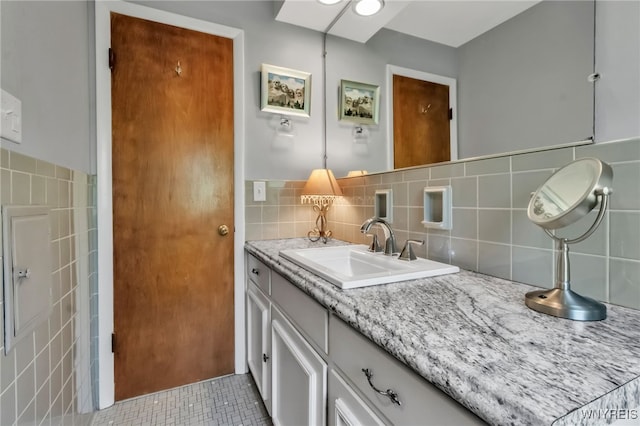 131 Idlewood Dr, Aurora, NY 14127 - bathroom with tile walls, vanity, and tile patterned flooring
