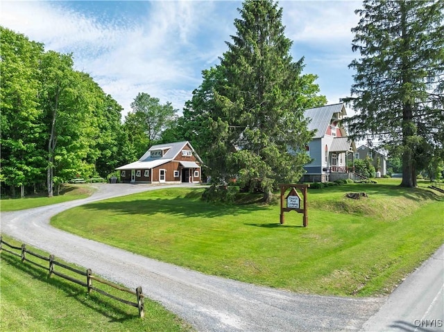 28 Bridge St, Albion, NY 13302 - view of front of home with driveway and metal roof