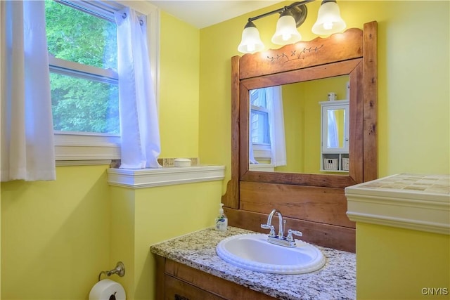 28 Bridge St, Albion, NY 13302 - half bath with vanity and a chandelier