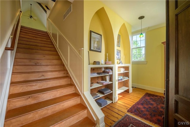 28 Bridge St, Albion, NY 13302 - stairway with hardwood / wood-style flooring, baseboards, and ceiling fan