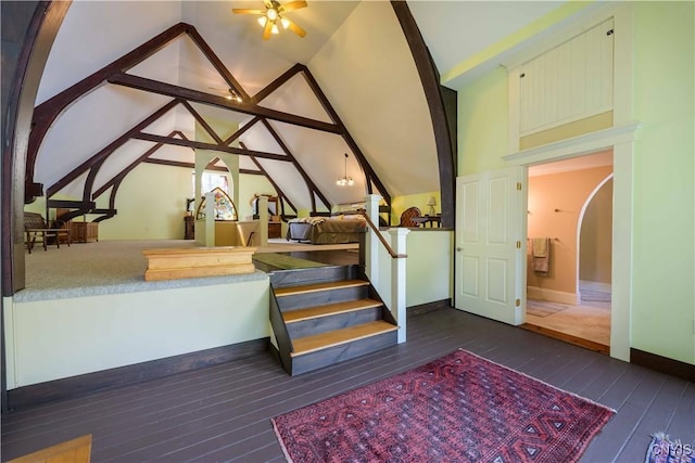 28 Bridge St, Albion, NY 13302 - stairway with hardwood / wood-style flooring, arched walkways, lofted ceiling, baseboards, and ceiling fan
