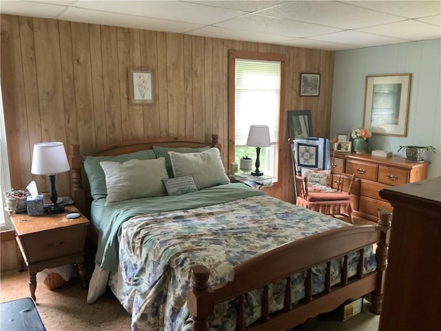 33 Hardy Hill Rd, Andover, NY 14806 - bedroom featuring wood walls, carpet floors, and a paneled ceiling