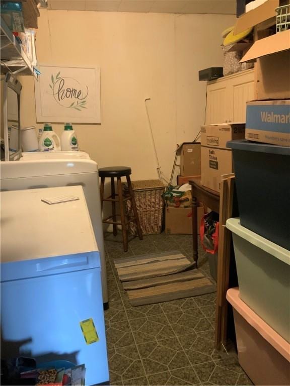 33 Hardy Hill Rd, Andover, NY 14806 - washroom with dark floors and estacked washer and dryer