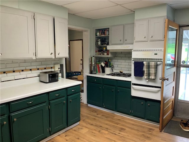 33 Hardy Hill Rd, Andover, NY 14806 - kitchen featuring green cabinets, a warming drawer, white appliances, backsplash, and light countertops