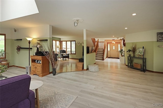 3485 Oran Delphi Rd, Pompey, NY 13104 - living room featuring healthy amount of natural light, light wood-type flooring, stairway, recessed lighting, and baseboards