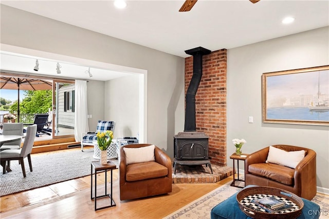 18 E Genesee St Unit 1, Skaneateles, NY 13152 - living room featuring a wood stove, wood finished floors, and recessed lighting