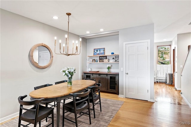 18 E Genesee St Unit 1, Skaneateles, NY 13152 - dining area with a chandelier, light wood-type flooring, recessed lighting, and baseboards