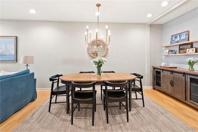 18 E Genesee St Unit 1, Skaneateles, NY 13152 - dining space with light wood-style flooring, a chandelier, recessed lighting, and baseboards