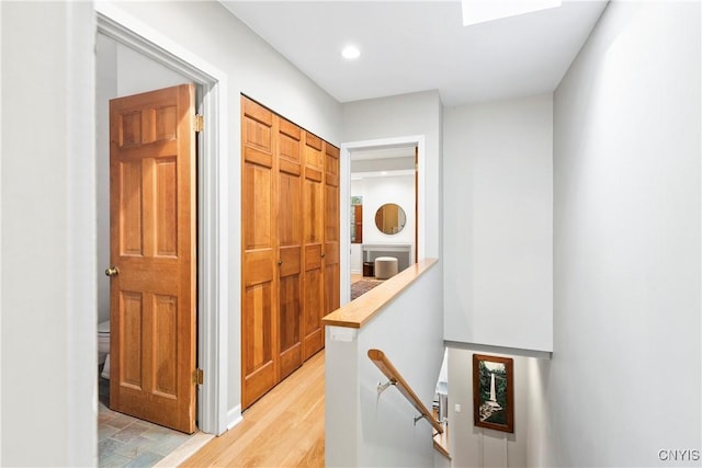 18 E Genesee St Unit 1, Skaneateles, NY 13152 - hall featuring an upstairs landing, light wood-style flooring, and recessed lighting