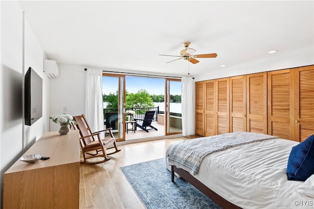 18 E Genesee St Unit 1, Skaneateles, NY 13152 - bedroom with a wall mounted air conditioner, access to outside, light wood-style flooring, ceiling fan, and recessed lighting