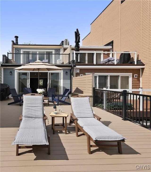 18 E Genesee St Unit 1, Skaneateles, NY 13152 - wooden terrace with a grill
