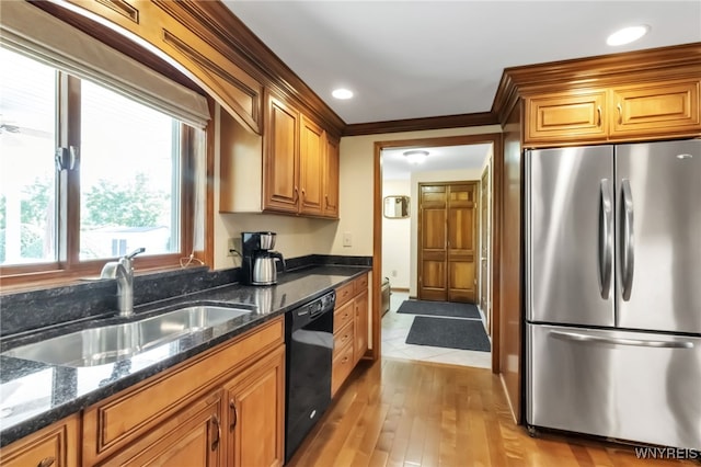 29 Brunck Rd, Lancaster, NY 14086 - kitchen featuring freestanding refrigerator, dishwasher, a sink, light wood finished floors, and brown cabinetry