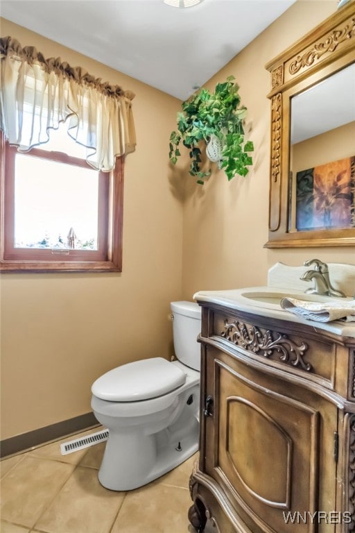 29 Brunck Rd, Lancaster, NY 14086 - bathroom featuring vanity, toilet, and tile patterned floors