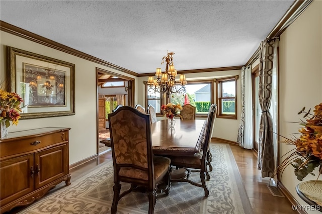 29 Brunck Rd, Lancaster, NY 14086 - dining space with a chandelier, a textured ceiling, wood finished floors, baseboards, and ornamental molding