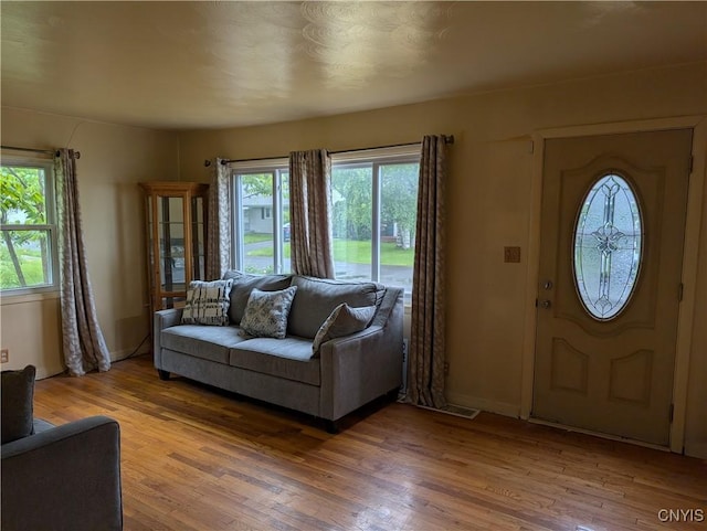 161 W Florence Ave, Syracuse, NY 13205 - entrance foyer with healthy amount of natural light, light wood-style floors, and baseboards