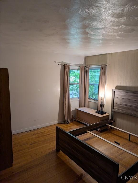 161 W Florence Ave, Syracuse, NY 13205 - bedroom featuring wood finished floors and baseboards